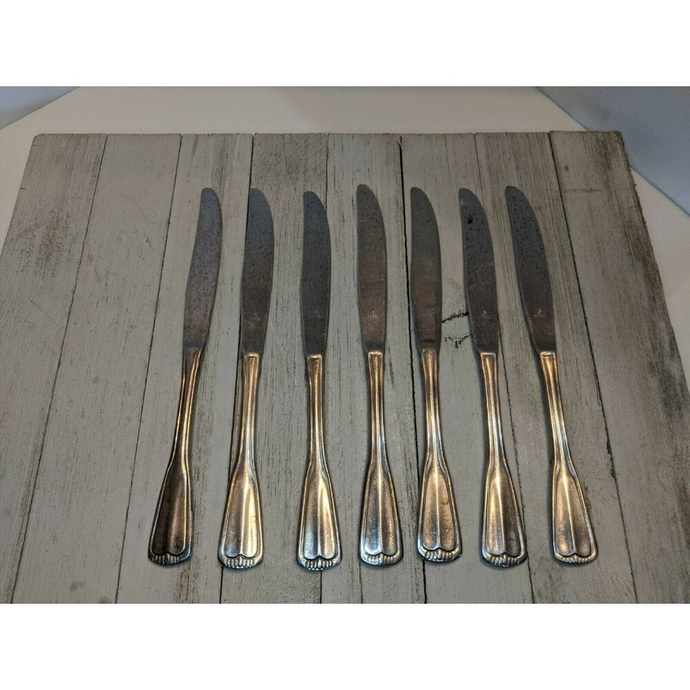 7 Stainless Steel Knives Marked "O inside Diamond" Korea Scalloped